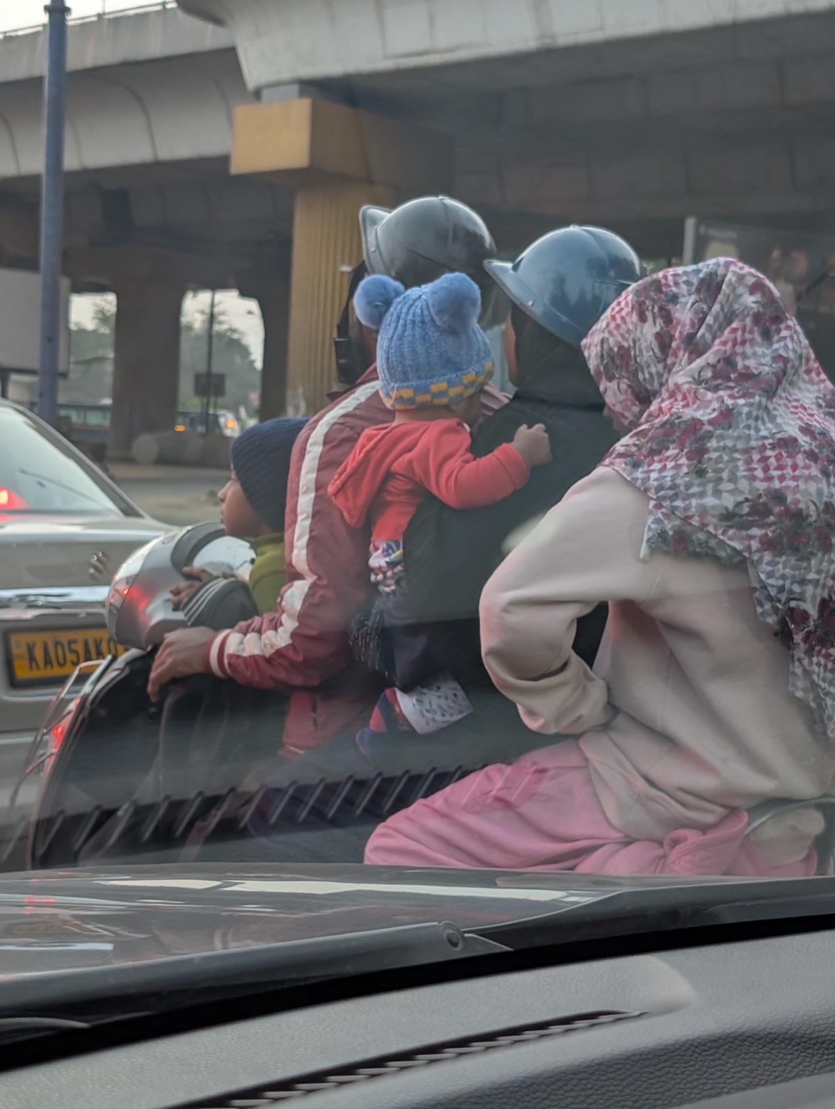 A family of 5 in a scooter